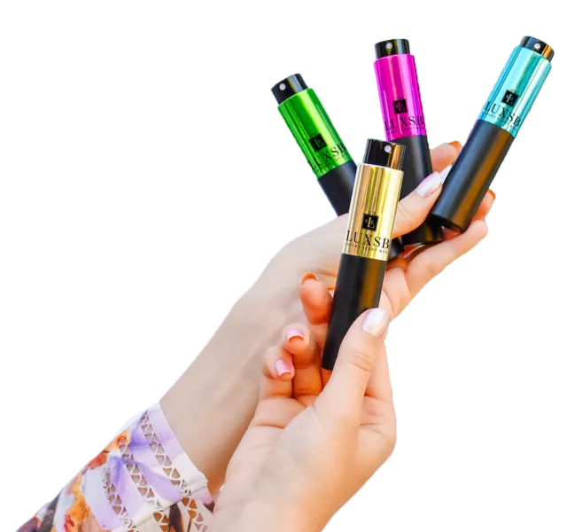 Hands holding atomizers